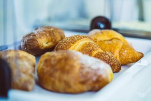 a bunch of donuts sitting on top of a table at Bluemoon Sardinia in Cagliari