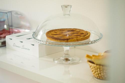 a cookie on a glass plate on a table at Bluemoon Sardinia in Cagliari