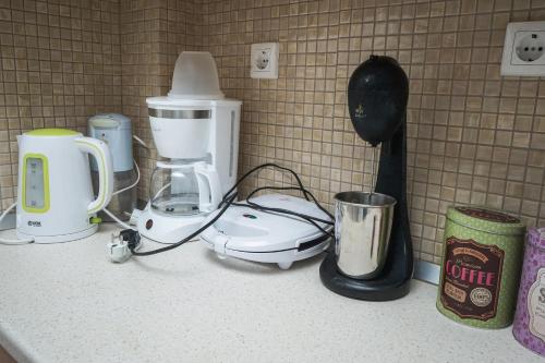 a counter top with a coffee maker on it at Nektarios Garenias Kipoupoli in Nea Kalikratia