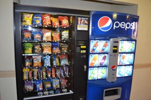 a pepsi vending machine with food and drinks at Red Carpet Inn Newark - Irvington NJ in Irvington