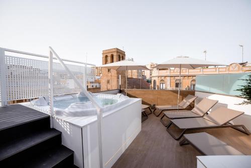 a hot tub on the roof of a building at Nuevo Torreluz in Almería