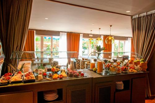 a buffet with a lot of food on a table at Chic & Basic Velvet in Barcelona