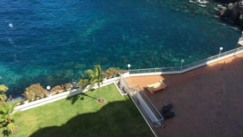 an aerial view of the ocean from a building at Mirador Playa San Marcos in Icod de los Vinos