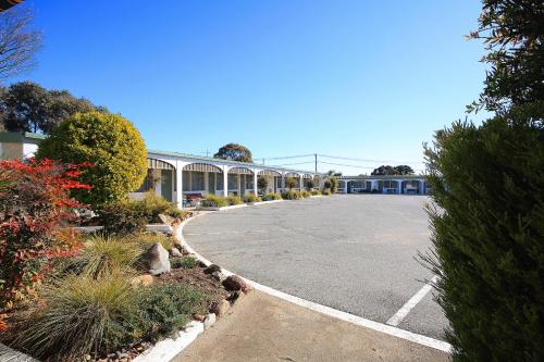 a parking lot in front of a building at Hi Way Motor Inn in Yass