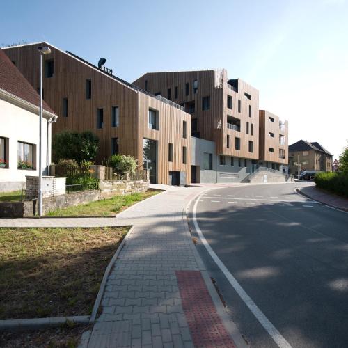 an empty street in front of some buildings at Lakepark Residence in Staré Splavy