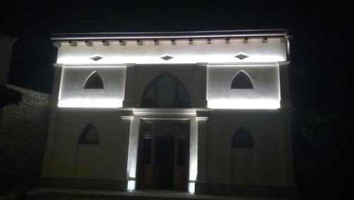 a model of a white house with lights on it at Antica Scuderia in Buttrio