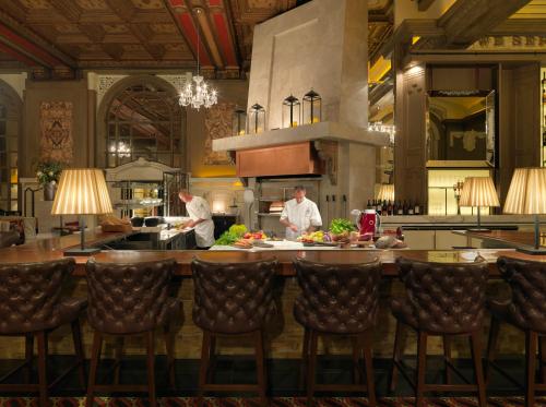 two chefs preparing food in a large kitchen at Fairmont Copley Plaza in Boston