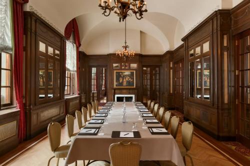 a large dining room with a long table and chairs at Fairmont Copley Plaza in Boston
