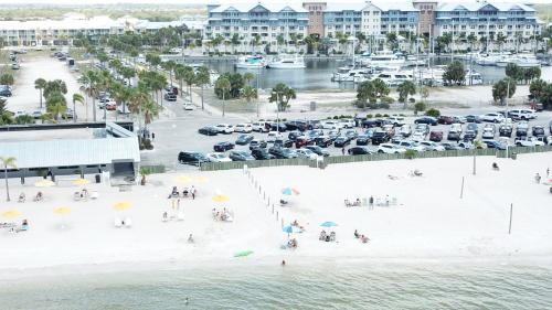 an aerial view of a beach with a parking lot at TAMPA BAY, BEACH step away, WIFI, FREE PARKING,POOLS, JACUZZI in Ruskin