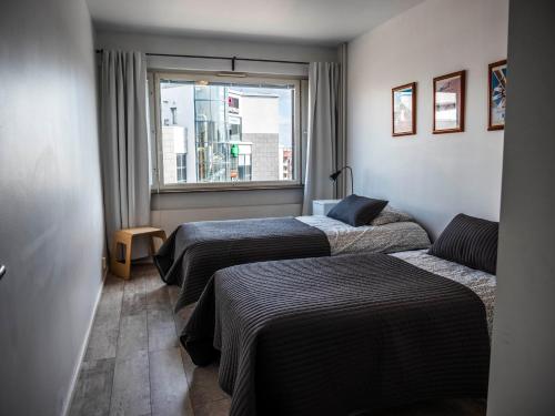 Postel nebo postele na pokoji v ubytování Paasi & Kivi Apartments