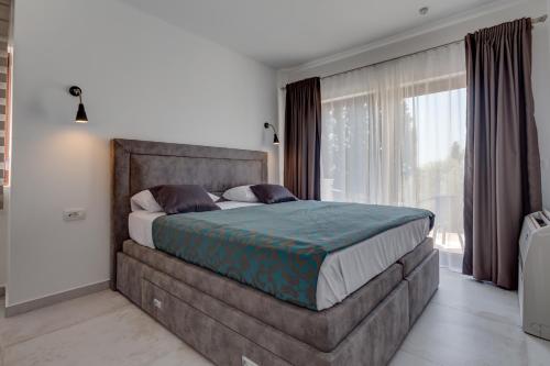 En eller flere senge i et værelse på Villa Zen Port
