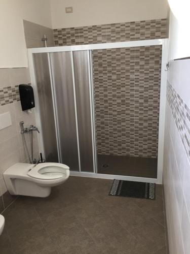 a small bathroom with a toilet and a shower at La Fontanella in Montecchia di Crosara