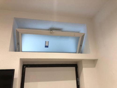 a window above a door in a room at Casa Vacanze Riva Destra in Ischia