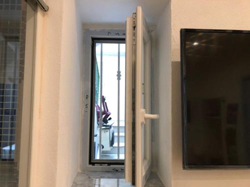 a sliding glass door with a view of a balcony at Casa Vacanze Riva Destra in Ischia