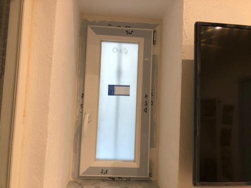 a mirror on a wall with a window in it at Casa Vacanze Riva Destra in Ischia