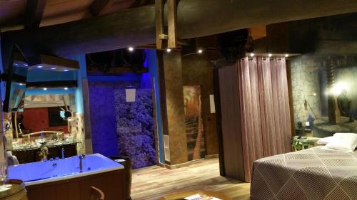 a large bathroom with a tub and a shower at Hotel SPA El Lagar de Isilla in La Vid y Barrios