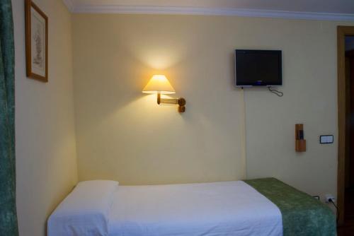 Letto o letti in una camera di Hotel Vall de Núria