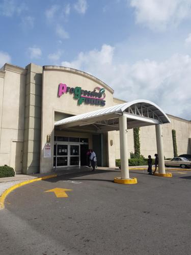 a building with a sign on top of it at Skycastle Oasis in Ocho Rios