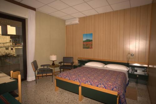 Säng eller sängar i ett rum på Hotel Quercia Antica