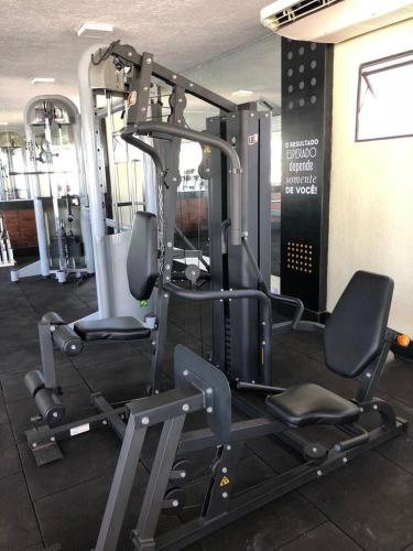 a gym with two tread machines in a room at Garbos Trade Hotel in Mossoró