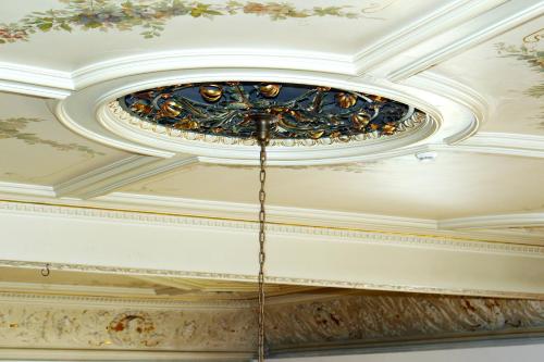 a coffered ceiling with a painting on it at Hotel Neustädter Hof in Titisee-Neustadt