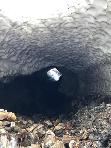 a black cave with a rock in the middle at Berghaus Außergschlöß in Matrei in Osttirol