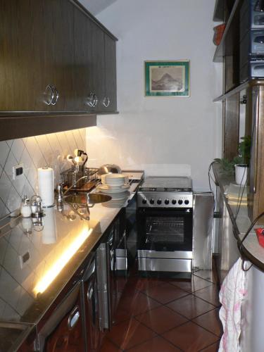 a kitchen with a stove and a counter top at Apartmaji Mak in Jesenice