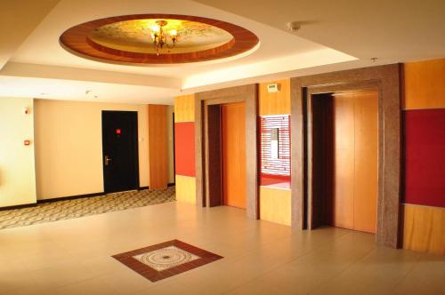 an empty room with a painting on the ceiling at Hotel Elizabeth Cebu in Cebu City