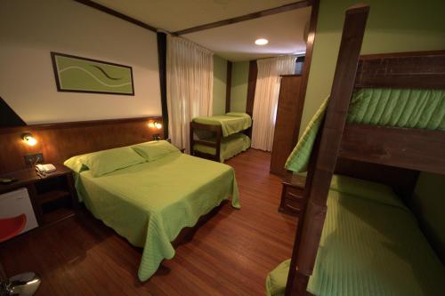 Postel nebo postele na pokoji v ubytování Sur Hotel