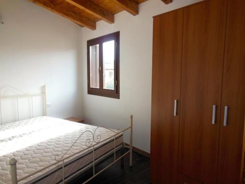 A bed or beds in a room at Residenza Il Pappagallo