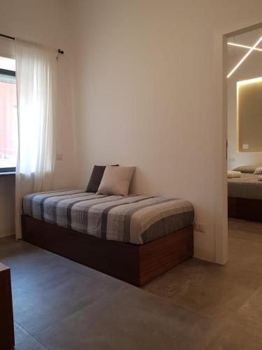 Postel nebo postele na pokoji v ubytování i 26 Gradini Capri