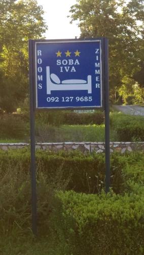 a blue sign for a spa ivaza on a road at Room "Iva" in Josipdol