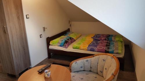 Een bed of bedden in een kamer bij Room with a High Tatras view and Fireplace