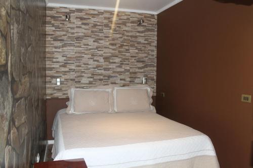 Postel nebo postele na pokoji v ubytování Hotel Manada del Desierto
