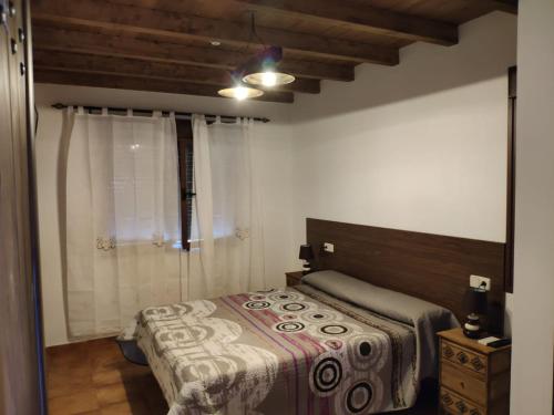 Giường trong phòng chung tại El Rincón de los Riveros