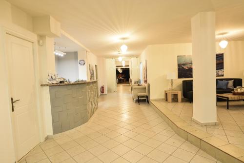 a hallway of a hospital with a waiting room at Marzi Boutique Hotel in Nerátza