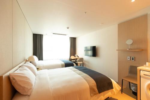 Ένα ή περισσότερα κρεβάτια σε δωμάτιο στο Hotel Winstory