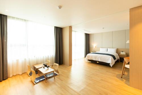 Postel nebo postele na pokoji v ubytování Hotel Winstory