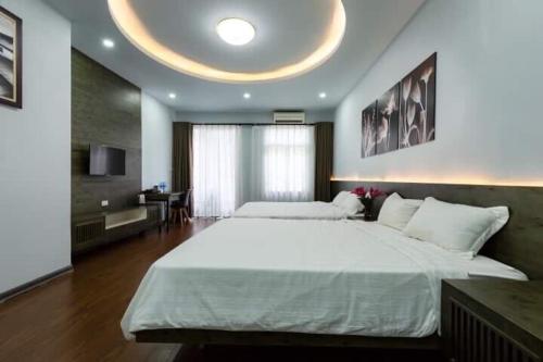 Cama o camas de una habitación en Hanoi Moon Cactus