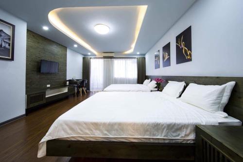 Cama o camas de una habitación en Hanoi Moon Cactus