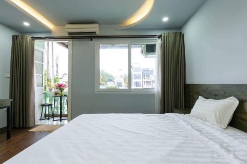 Cama o camas de una habitación en Hanoi Moon Cactus
