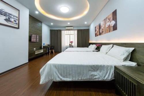 Cama o camas de una habitación en Hanoi Moon Cactus