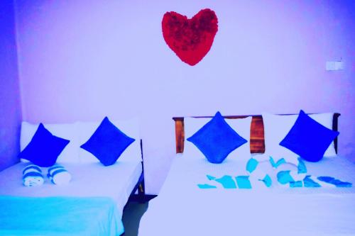 מיטה או מיטות בחדר ב-Gloriya Mathews