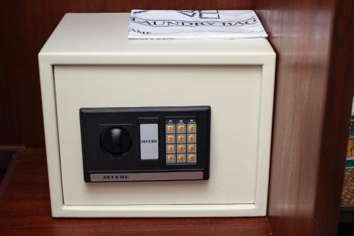 a small white microwave oven with a box on top at Cabana Lipe Beach Resort in Ko Lipe