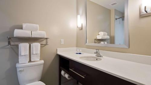 a bathroom with a sink and a toilet and a mirror at Best Western Gettysburg in Gettysburg