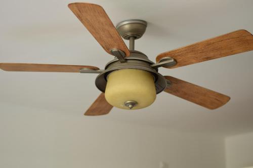 a ceiling fan hanging from a ceiling at the beachhouse in Dalaguete