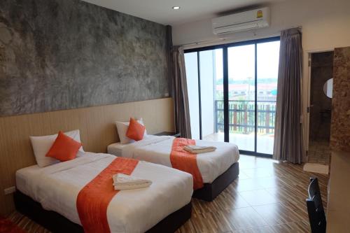 Ένα ή περισσότερα κρεβάτια σε δωμάτιο στο BK Place Hotel