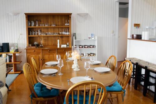 a dining room with a table and chairs at Valley View Luxury Retreat in Vacy