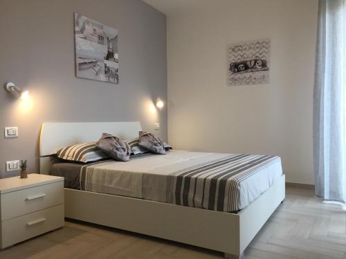 Katil atau katil-katil dalam bilik di Le Domus Modern Apartments Cagliari