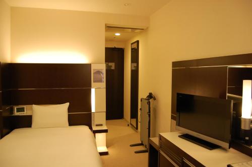 Uma TV ou centro de entretenimento em Cross Wave Umeda